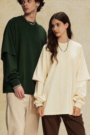 Oversized long sleeve tee in beige with layered sleeves and crew neck.
