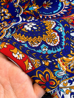 Chic cami and wide-leg pant ensemble fabric with colorful paisley print in Royal Blue.