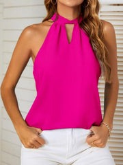 Fuchsia pink halterneck top with keyhole cutout and tie-back detail.