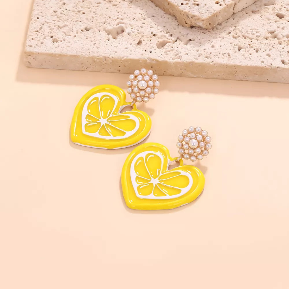 Yellow heart-shaped lemon slice dangle earrings with pearl accents