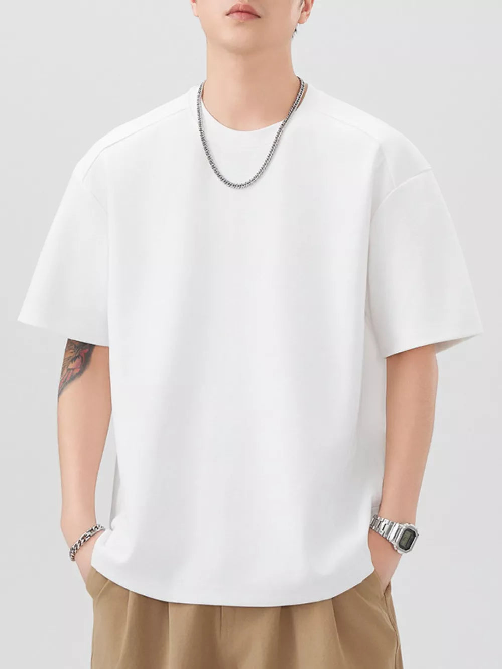 Oversized off-white cotton blend men's t-shirt with crew neck and short sleeves.