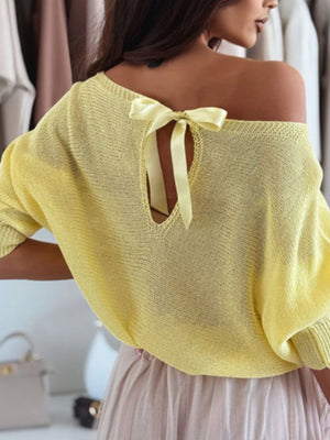 Yellow batwing knit sweater with off-shoulder neckline and bow back detail