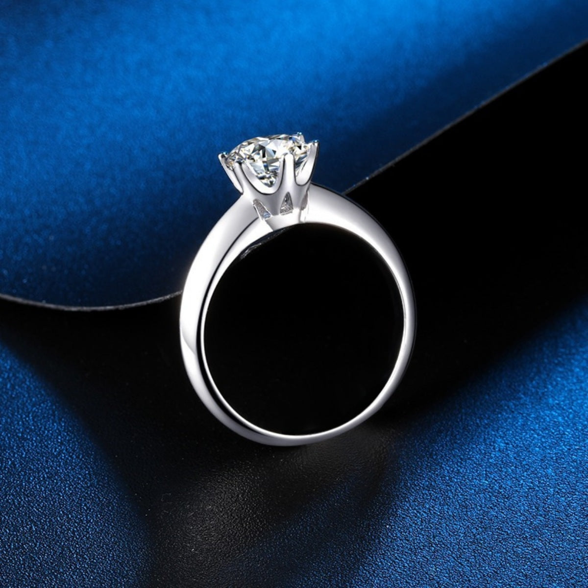 Sterling silver solitaire ring with a brilliant moissanite stone.