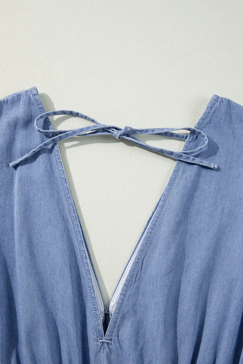 Light wash denim maxi dress with plunge back and tie detail