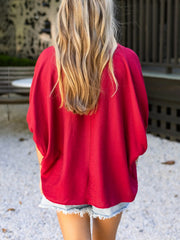 Deep red braided V-neck half sleeve blouse with a relaxed fit.
