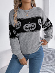 Gray acrylic knit sweater with jack-o'-lantern intarsia pattern and crew neck.