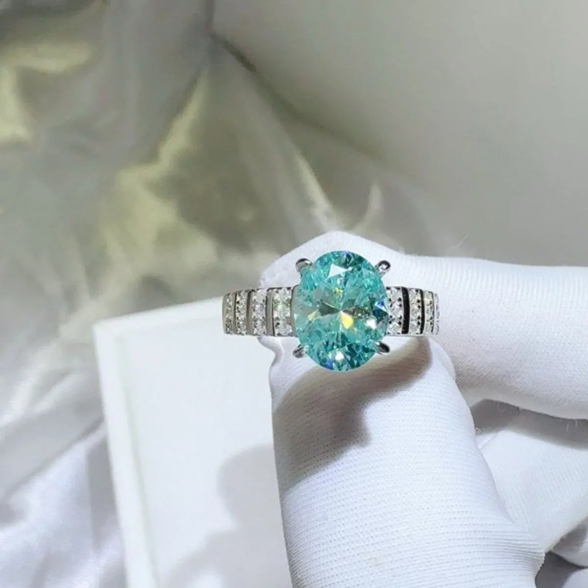 Aquamarine halo oval ring with diamond band.