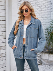 Oversized denim jacket in dusty blue with button front and chest pockets.