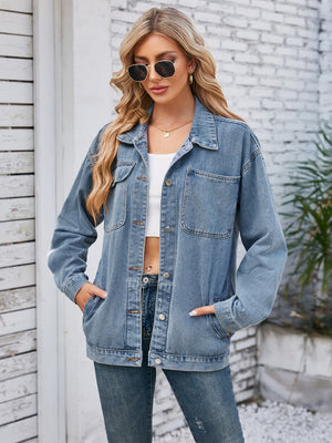 Oversized denim jacket in dusty blue with button front and chest pockets.