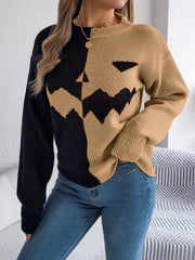 Split-Face Pumpkin Knit Sweater in black and camel acrylic with a jack-o-lantern face detail.