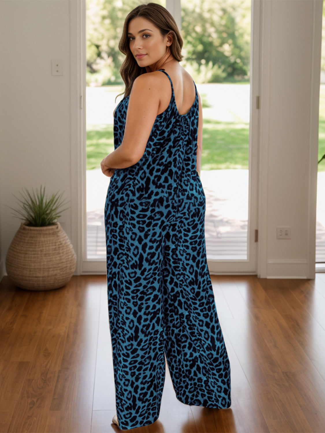 Cami leopard print palazzo jumpsuit in teal with spaghetti straps and wide legs.