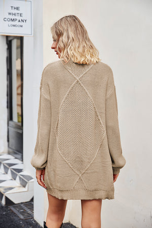 Tan cable knit cardigan with diamond pattern detail on back, acrylic.