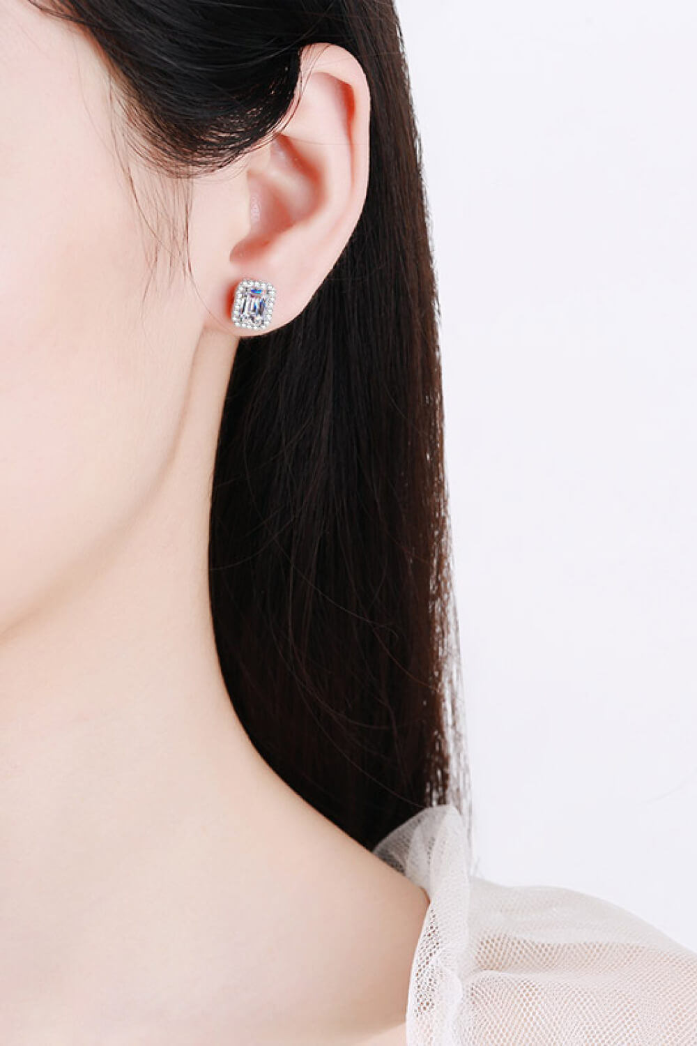Silver emerald cut halo stud earrings with clear stones
