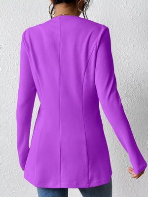 Purple single-button blazer with tailored fit and textured fabric.