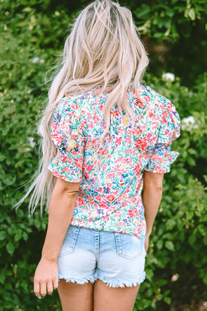 Floral ruffle collar puff sleeve blouse with smocked cuffs.