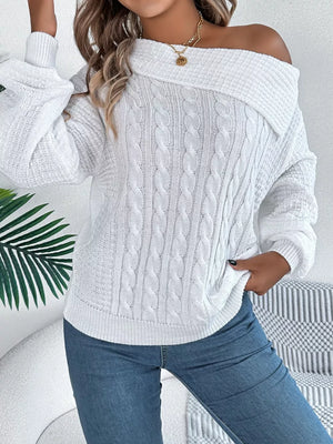 White off-shoulder cable knit sweater with a relaxed fit and wide neckline.