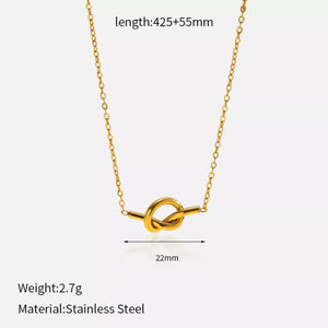 Gold-plated knot pendant necklace with delicate chain.