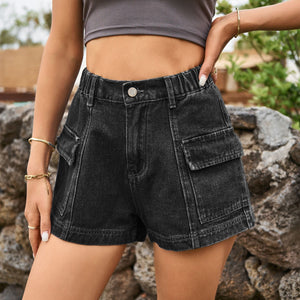 Black denim high-rise shorts with utility pockets and elastic waistband.