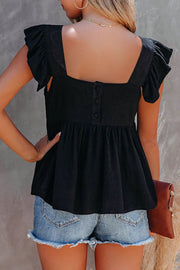 Black linen babydoll blouse with flutter sleeves and square neckline, button back detail.