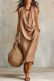Tan cowl neck midi dress with pockets and a draped neckline.