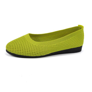 Lime green breathable knit ballet flats with a black sole.