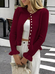 Burgundy knit cardigan with ruffled cuffs and button front.