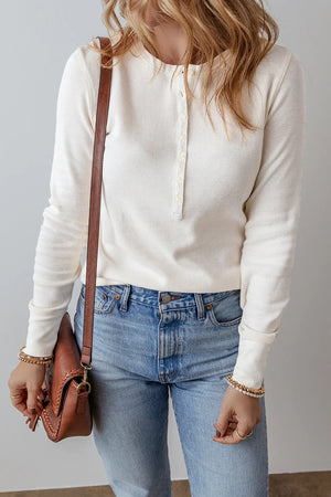 White waffle knit long sleeve henley blouse with button placket and crew neck