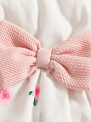 Baby dress with pink bow detail and floral print