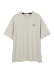 Oversized gray t-shirt with minimalist emblem logo and crew neck.