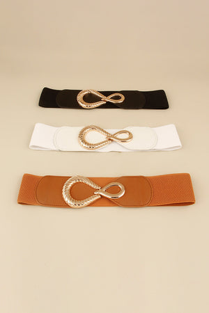 Elasticated waist belt in black, white, and caramel with sculpted gold buckle.