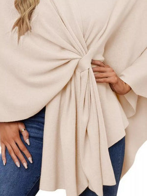 Eggshell knit cape top with tie-front detail and draped elegance