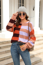 Pastel block stripe crewneck pullover sweater in orange, blush pink, and khaki with a crew neck and long sleeves.