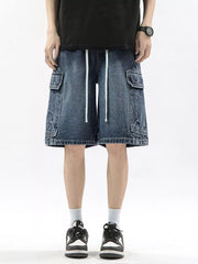 Men's denim cargo shorts in Vintage Blue with drawstring waist and multiple pockets.