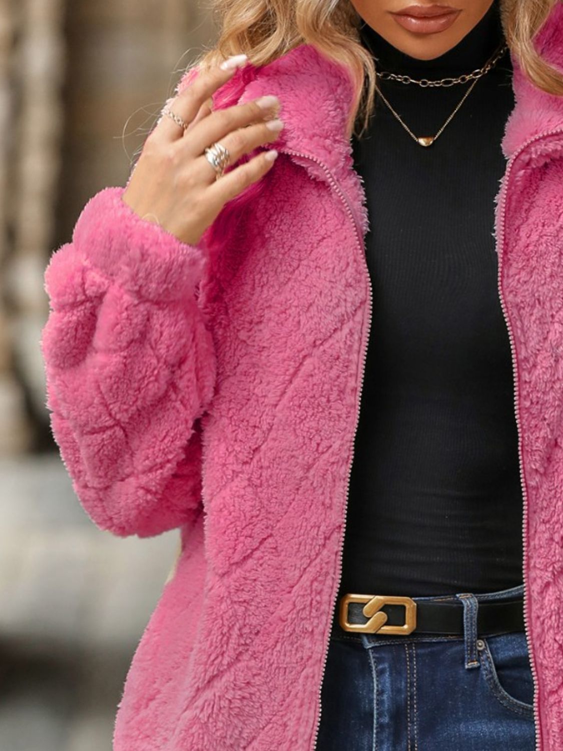 Pink textured teddy zip-up jacket with a quilted pattern and fuzzy material.