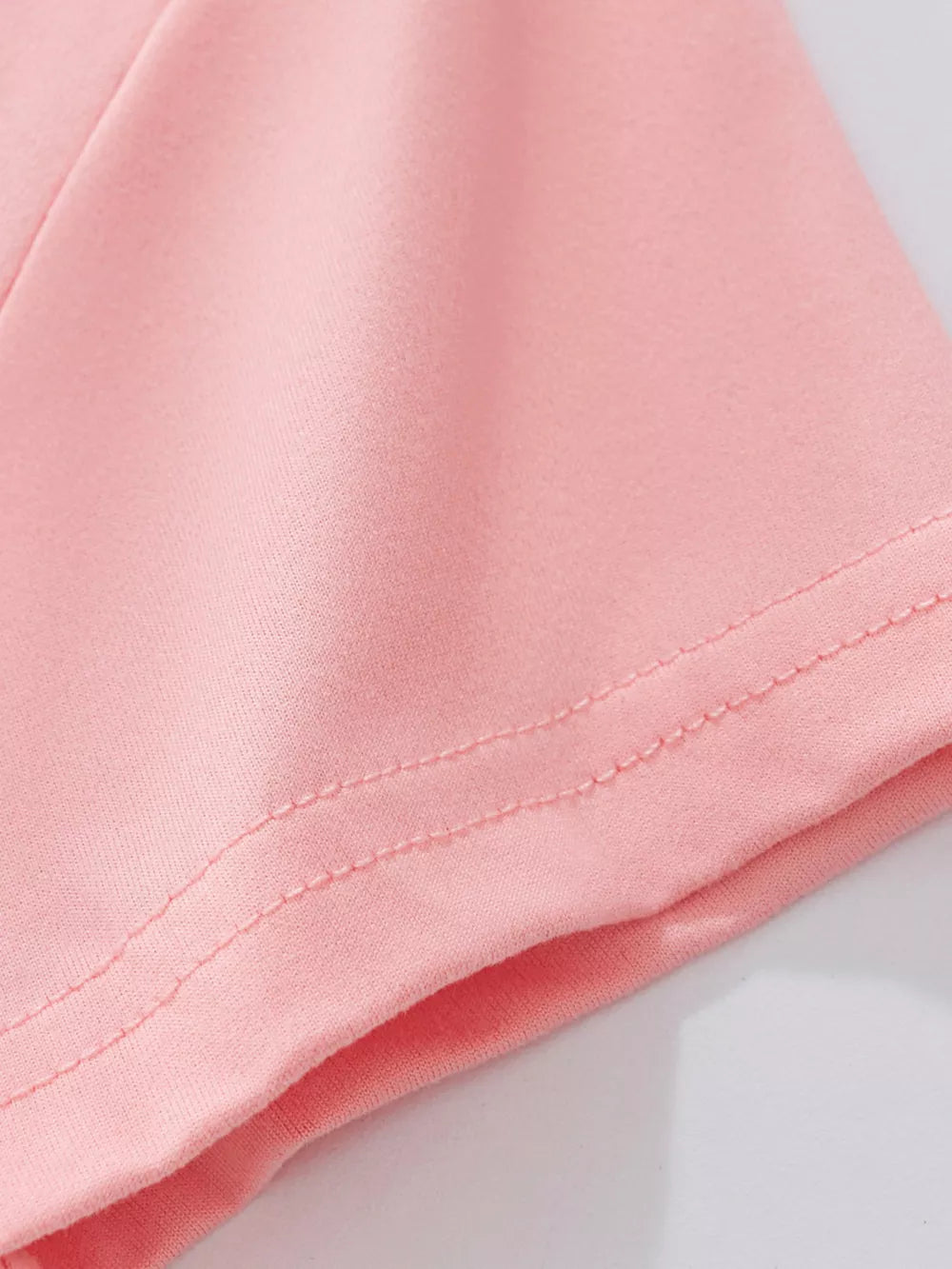 Toddler girls' blush pink underwear set detail showing double-stitched hem.