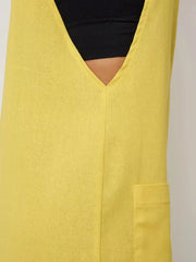 Yellow cotton romper with V-neck and patch pocket detail