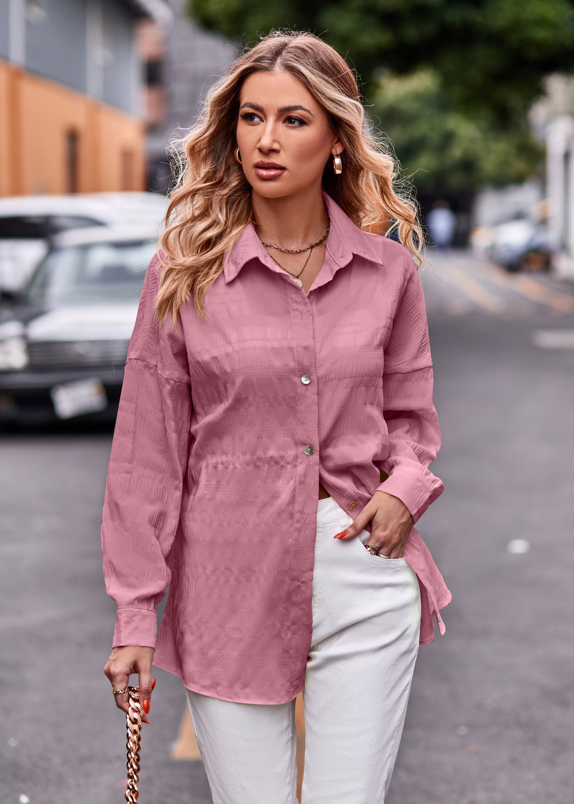 Dusty pink textured overshirt with relaxed fit and buttoned front, styled with white pants.