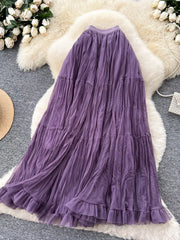 Elegant tiered tulle skirt in purple with ruffled hem and lining.