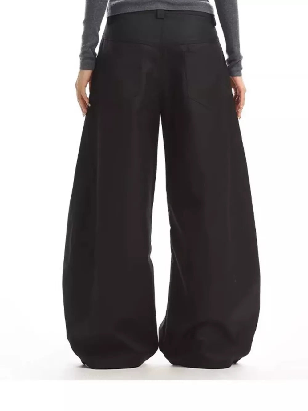 Black relaxed fit button-fly wide-leg chinos with decorative back pockets.