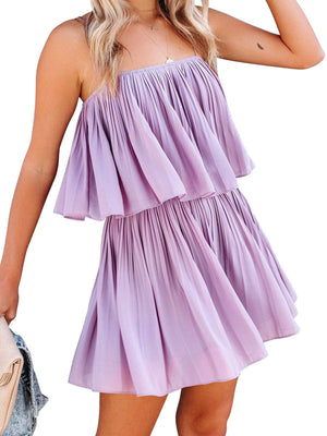Lilac cami romper with delicate straps and tiered pleated skirt.