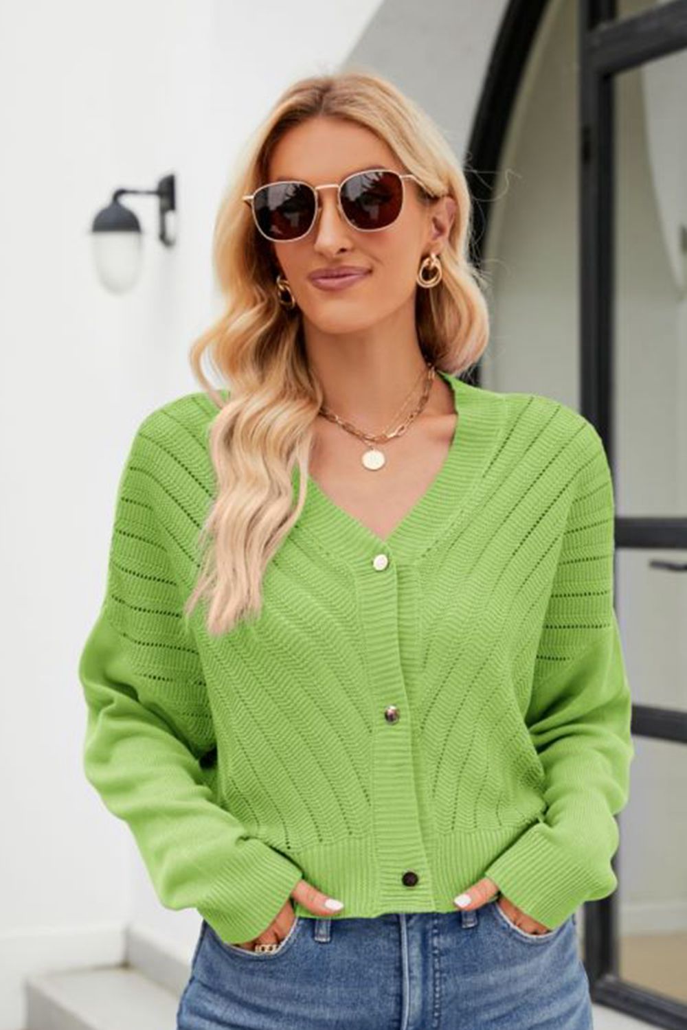 Textured stitch cropped v-neck cardigan in yellow-green with button front and open knit details.