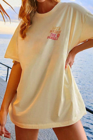 Oversized khaki t-shirt with "Let's Watch The Sunset" graphic print and a crew neck.