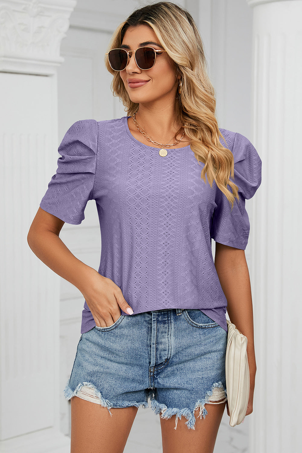 Perforated puff sleeve top in lavender with a textured pattern and crew neck.