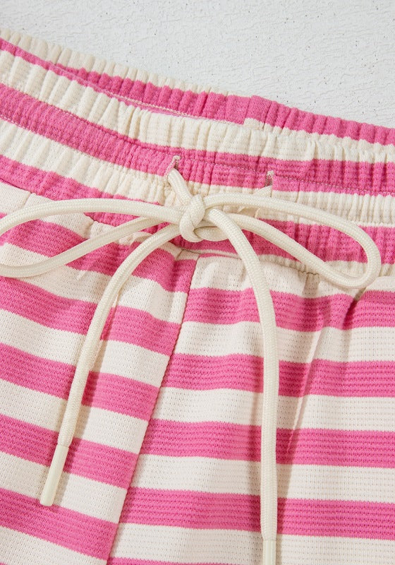 Pink and white striped lounge shorts with drawstring waist