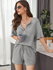 Relaxed waffle knit henley short set in dark gray with V-neck and drawstring shorts.