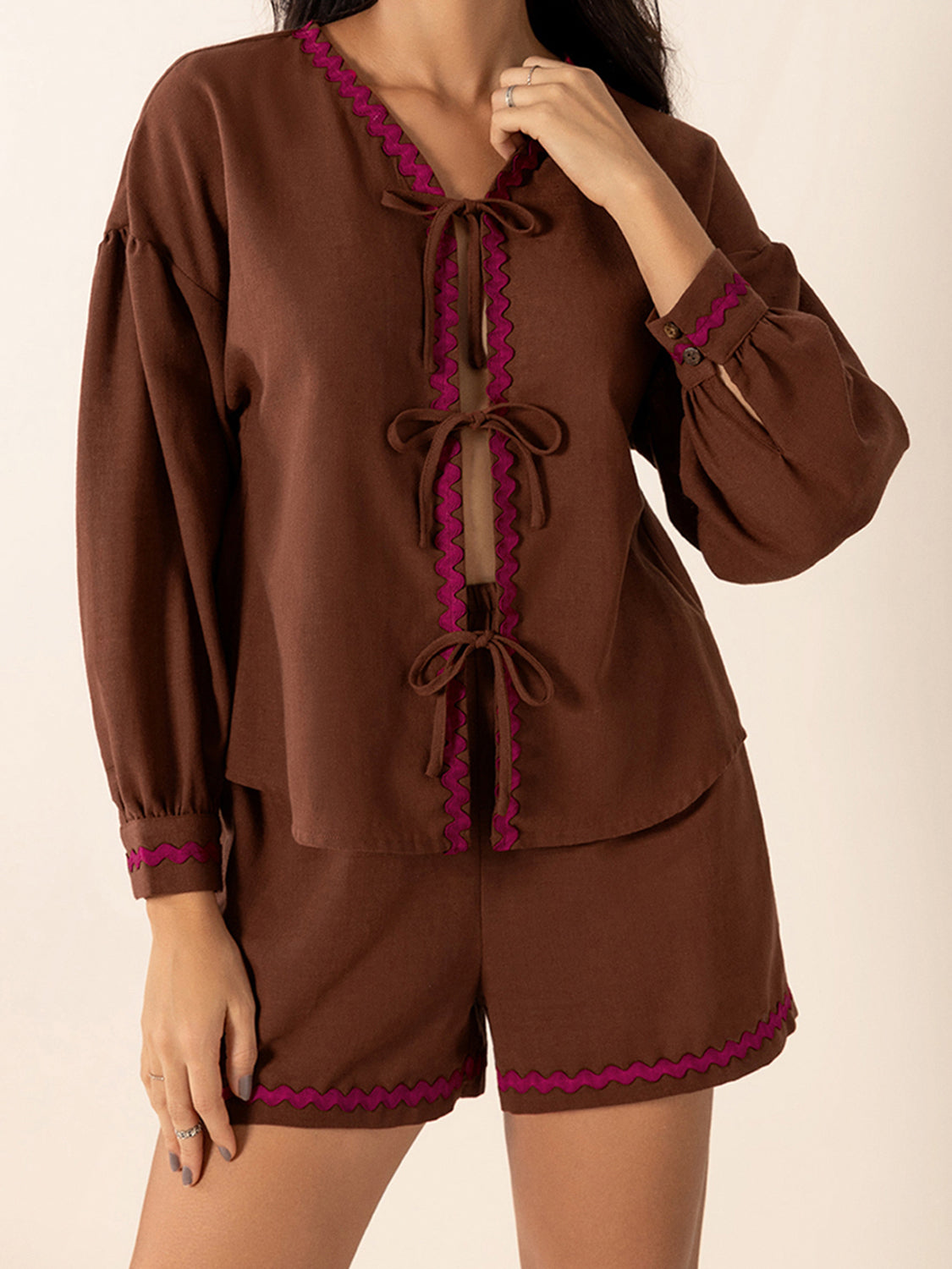 Brown linen tie-front pajama set with scallop trim and puff sleeves.