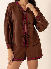 Brown linen tie-front pajama set with scallop trim and puff sleeves.