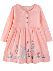 Watermelon pink polka dot cotton dress with embroidered bunnies and flowers.