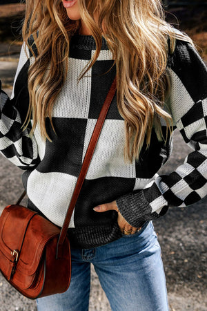 Colorblock checkerboard knit sweater in black and white acrylic with crewneck.