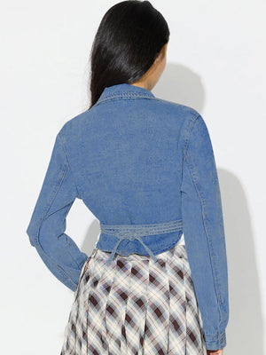Medium wash denim wrap jacket with tie waist, long sleeves, and collar.